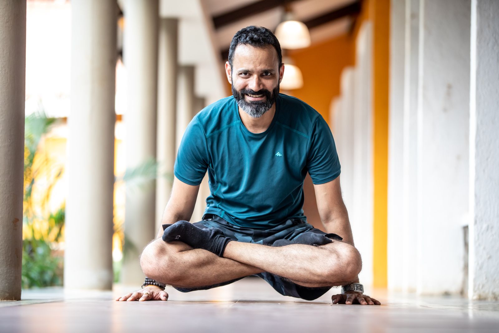 An adult practicing yoga outdoors