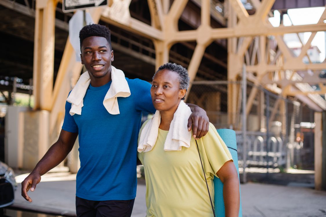 Two adults enjoying a walk together after exercise